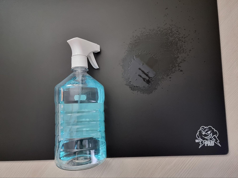clean glass mousepad with hand sanitizer